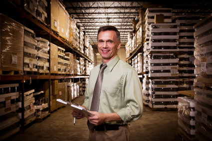 Successful Businessman in Warehouse